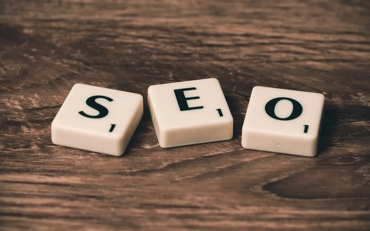 SEO spelled with letter tiles on a wooden table
